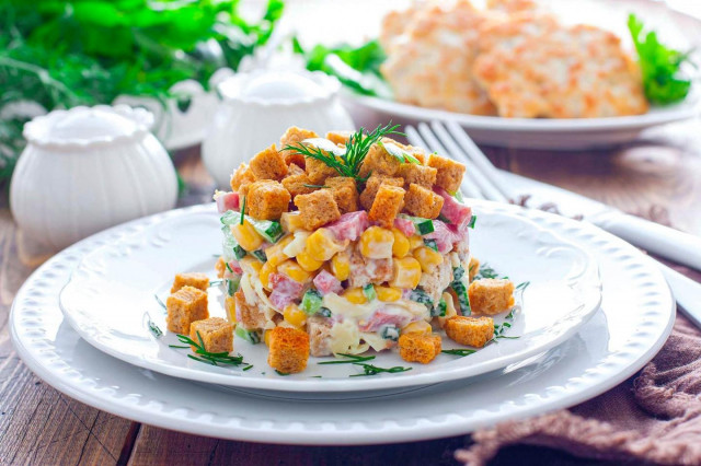 Salad with crackers and corn and sausage
