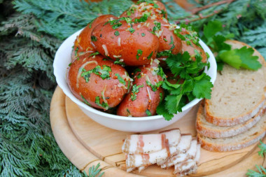 New potatoes with garlic in a uniform with fragrant dressing