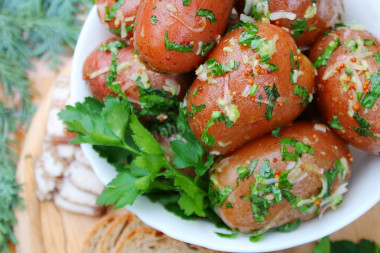 New potatoes with garlic in a uniform with fragrant dressing