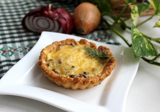 Homemade tartlets with mushrooms and cheese without mayonnaise