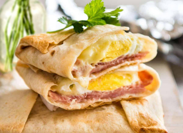 Hot pita bread with ham and egg in the oven