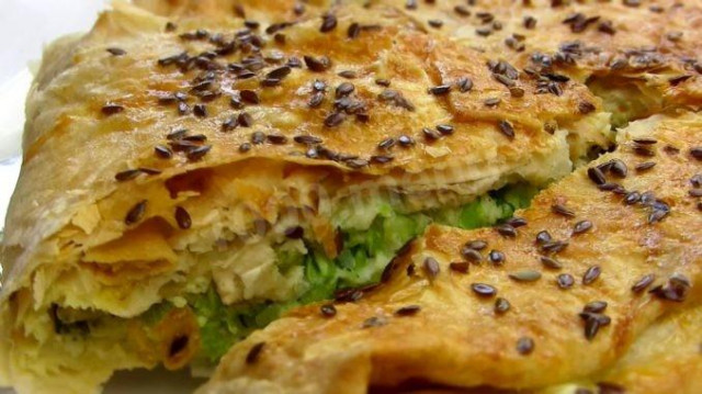 Lavash pie with zucchini and cheese cheese in the oven