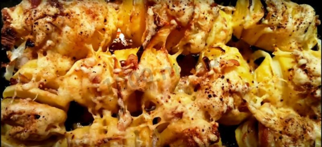 Potatoes with soft cheese and bacon baked in the oven