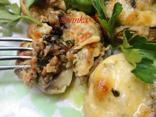 Stuffed mushrooms baked with cheese in the oven