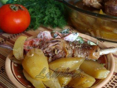 Chicken baked in the oven with potatoes