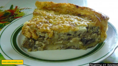 Potato casserole with mushrooms, onions and cheese in the oven