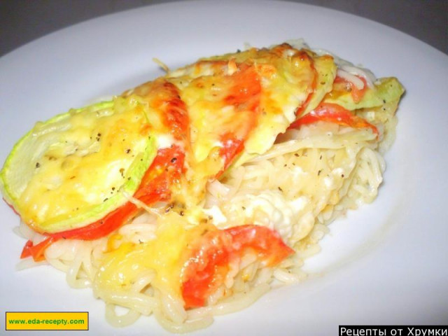 Casserole of zucchini and macaroni and cheese in the oven