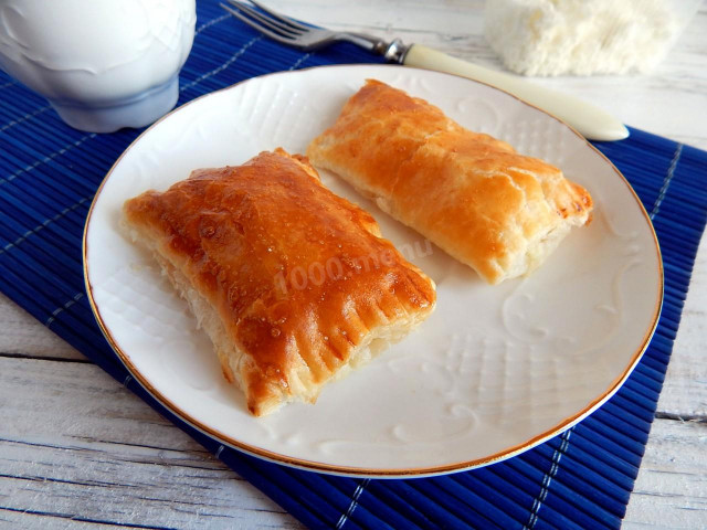 Salted puff pastry envelopes dough with cottage cheese