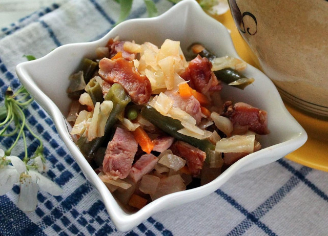 Stew with cabbage beans and smoked chicken in pots