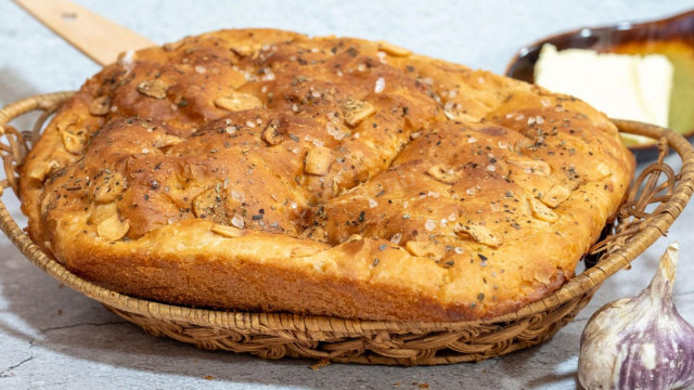 Focaccia bread with herbs and garlic in Italian