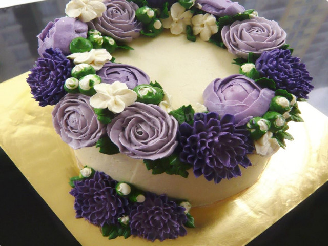 Cream cake with blue flowers