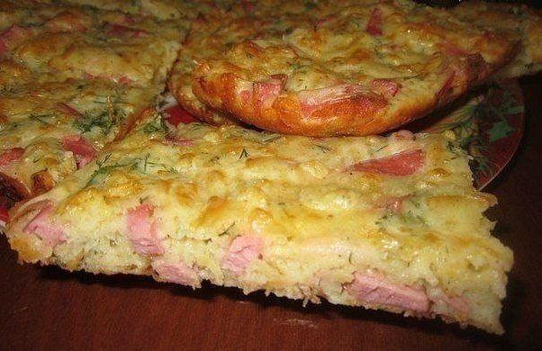 Quick kefir pie with cheese, onions and boiled sausage