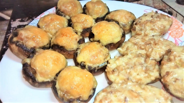 Stuffed mushrooms and potatoes with cheese and minced meat