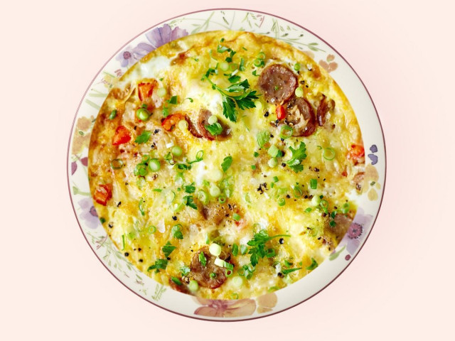 Omelet like in kindergarten with sausages and greens