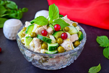 Salad with chicken, green peas, cucumber and egg