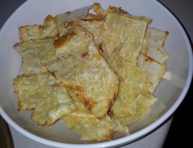 Pita bread chips with egg cheese and sausage