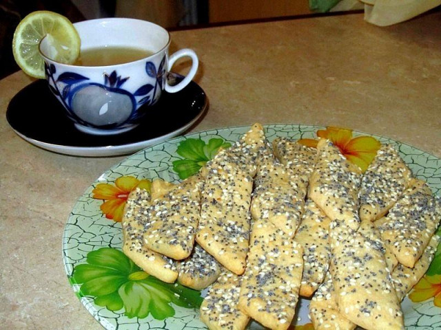 Unsweetened cookies with poppy seeds on mayonnaise melting in the mouth