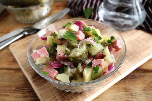 Salad with sausage, pickled cucumber and potatoes