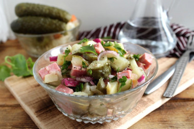 Salad with sausage, pickled cucumber and potatoes