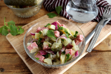 Salad with sausage, pickled cucumber and potatoes