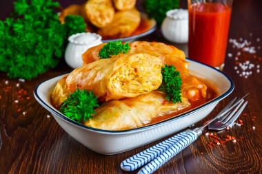 Stuffed cabbage rolls with minced chicken and rice in a saucepan
