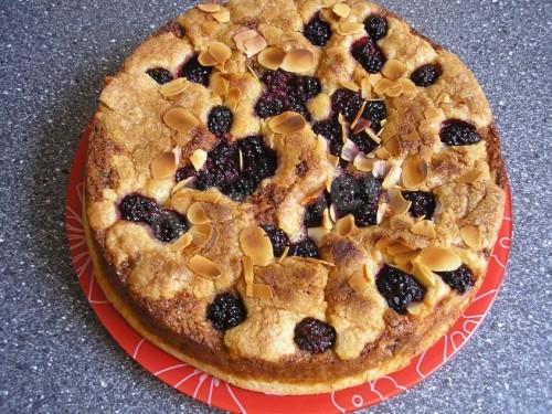 Pie with blackberries and cottage cheese made from rich yeast dough