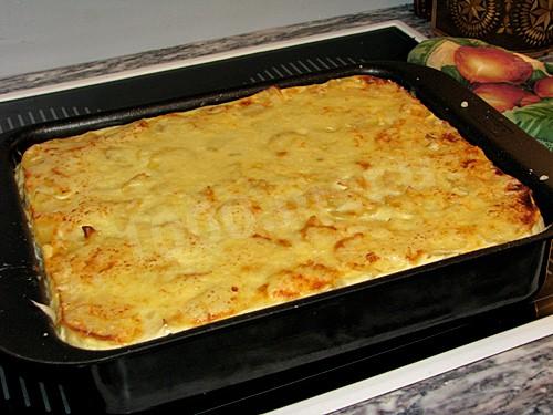 Potato casserole with mushrooms, cream, cheese and onions