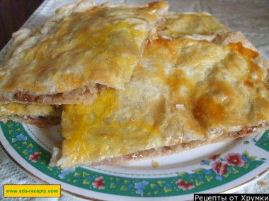 Strudel apple pie with raisins and nuts from puff pastry