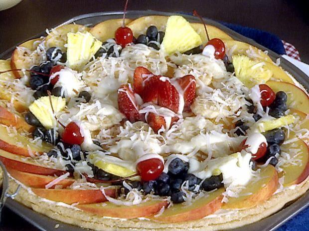 Pizza on pastry with fruits and berries