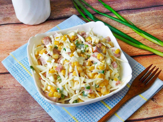 Salad with smoked sausage, corn and cabbage