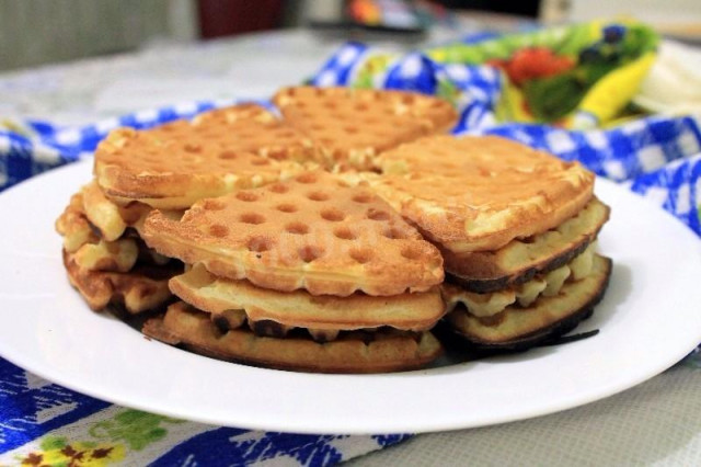 Soft waffles in a waffle iron on gas