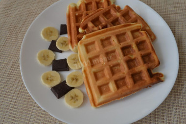 Viennese vanilla waffles with sour cream in an electric waffle iron