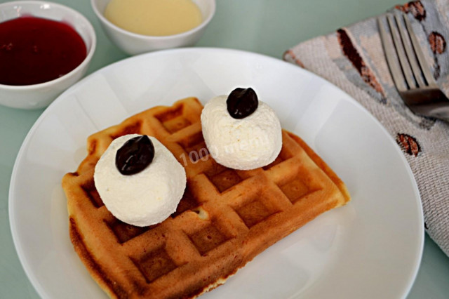 Viennese vanilla waffles with sour cream in an electric waffle iron