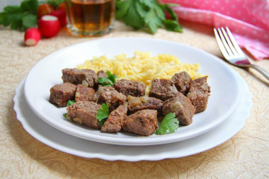 Beef stew in a slow cooker with onions