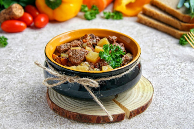 Beef stew in a slow cooker with potatoes