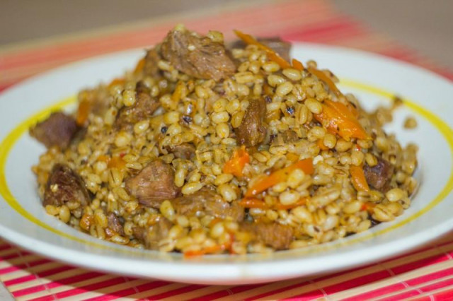 Pearl barley pilaf in slow cooker with meat