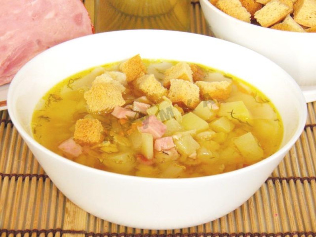 Soup with smoked meats in a slow cooker