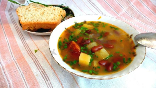 Bean soup in a slow cooker with meat broth