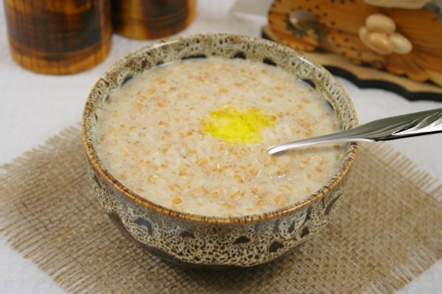 Sweet porridge with wheat groats on milk in a slow cooker