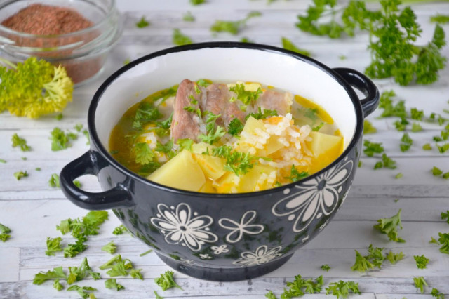 Soup with rice and ribs in a slow cooker