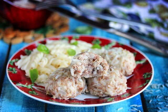 Meatballs with rice in a slow cooker