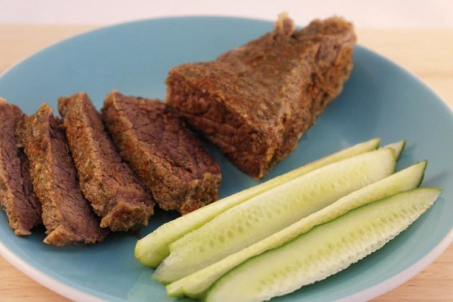 Steamed meat with spices in a slow cooker