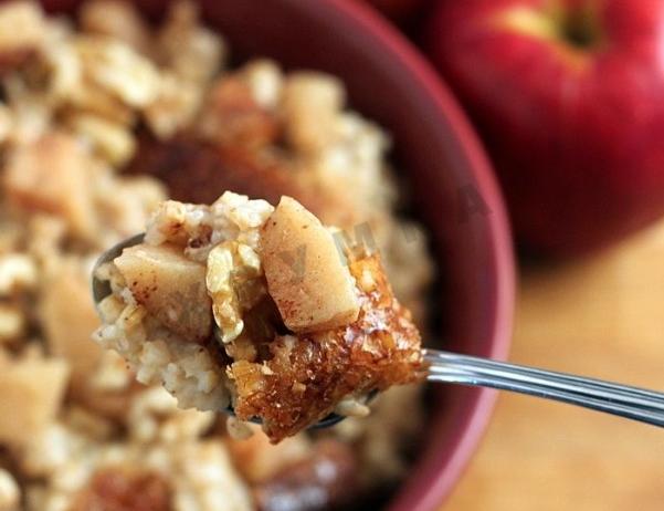 Overnight oatmeal porridge with apples and nuts in a slow cooker