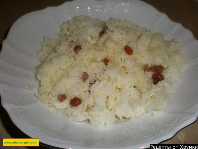 Rice porridge with dried fruits in a slow cooker with milk