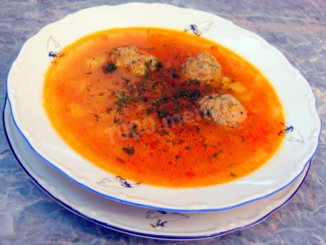 Vegetable soup with meat balls in a slow cooker