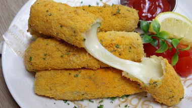 Snack sticks with cheese in milk breading with parsley