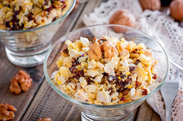 Salad with chicken and prunes, cheese and walnuts