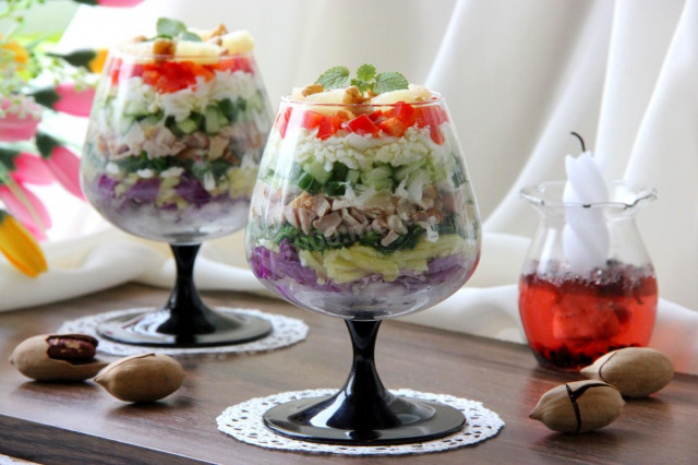 Layered salad with chicken and pineapples