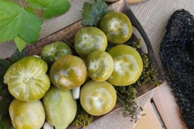 Green tomatoes in a barrel for winter