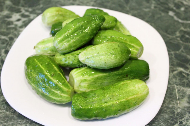 Lightly salted cucumbers on mineral water